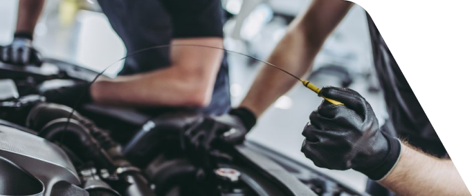 Mechanic Checking Car Engine Oil Level